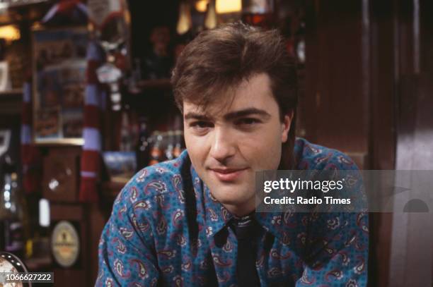 Actor Nick Berry pictured behind the bar of the Queen Victoria pub on the set of the BBC soap opera 'EastEnders', January 9th 1985.