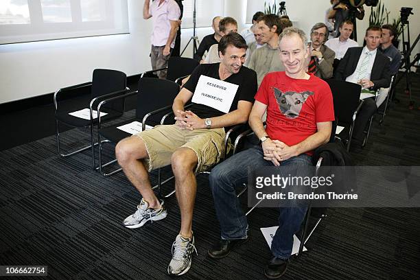 Tennis players John McEnroe of the United States and Goran Ivanisevic of Croatia share a joke during a media session for the Champions Downunder...