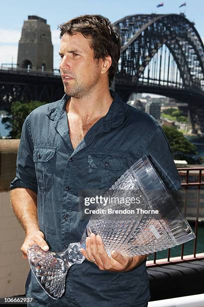 Tennis player Pat Rafter of Australia holds the Champions Down Under Trophy during a media session for the Champions Downunder Tournament at Events...