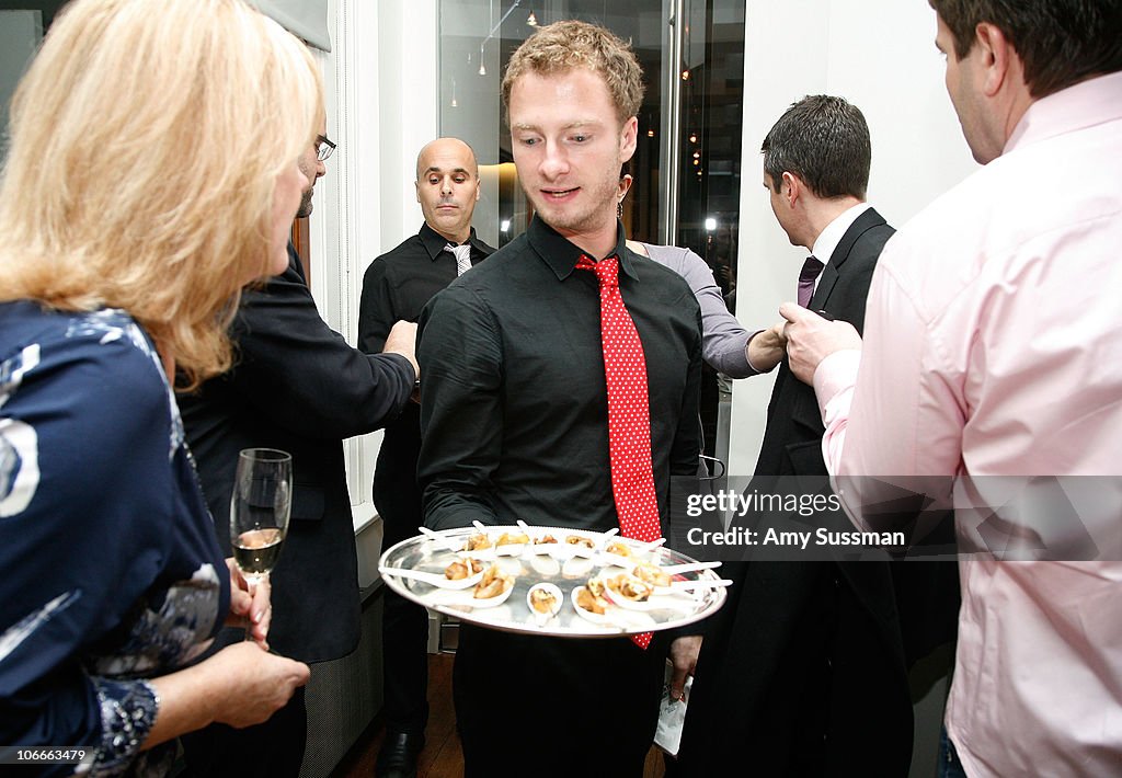 Liaison Culinary Waiter serves h'orderves at the Culinary Liaisons Culinaires Dinner ...