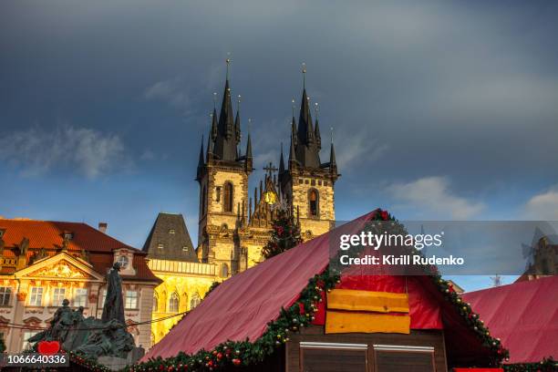 tyn church and a christmas market kiosk in old town square in prague - prague christmas market old town stock pictures, royalty-free photos & images