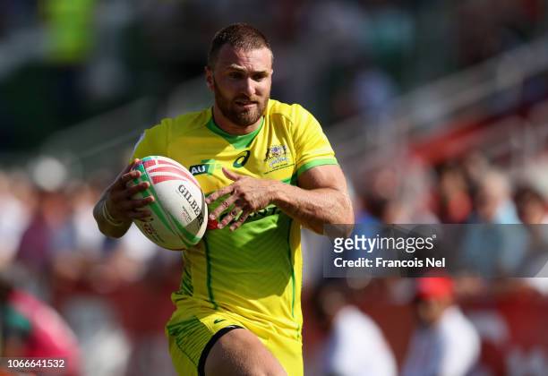 Lewis Holland of Australia runs with the ball during the match between Australia and Japan during Day Two of the Emirates Airline Dubai Sevens, the...