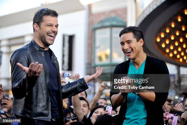 Ricky Martin with host Mario Lopez visits the set of television entertainment show "Extra" filming at The Grove on November 9, 2010 in Los Angeles,...