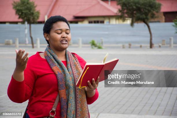 woman reading a book - poet stock pictures, royalty-free photos & images