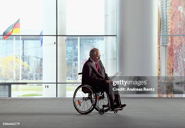 German Finance Minister Wolfgang Schaeuble reads documents at the Chancellery on November 10, 2010 in Berlin, Germany. Schaeuble and German...