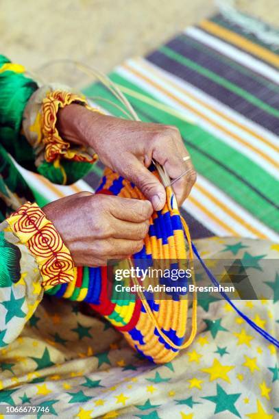 hands of nubian woman making crafts - africa craft stock-fotos und bilder