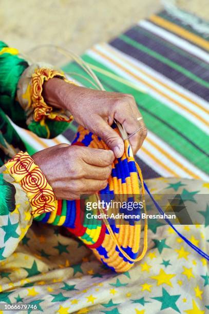 hands of nubian woman making crafts - アスワン ストックフォトと画像