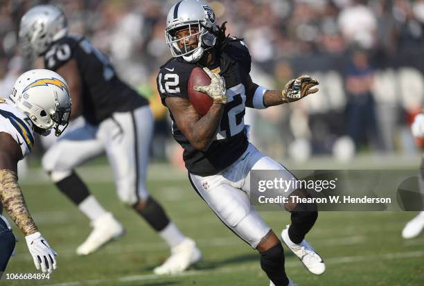 Martavis Bryant of the Oakland Raiders runs with the ball after catching a pass against the Los Angeles Chargers during the first half of their NFL...