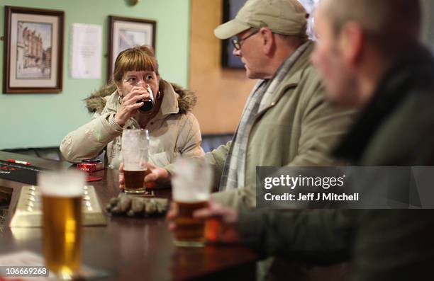 Woman enjoys a drink in a Govan pub on November 10, 2010 in Govan, Glasgow, Scotland. MSP's are set to vote on the SNP government's Alcohol Bill...