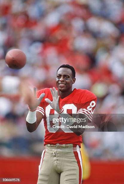 Jerry Rice of the San Francisco 49ers warms up before a National Football League game against the New England Patriots played at Stanford Stadium on...