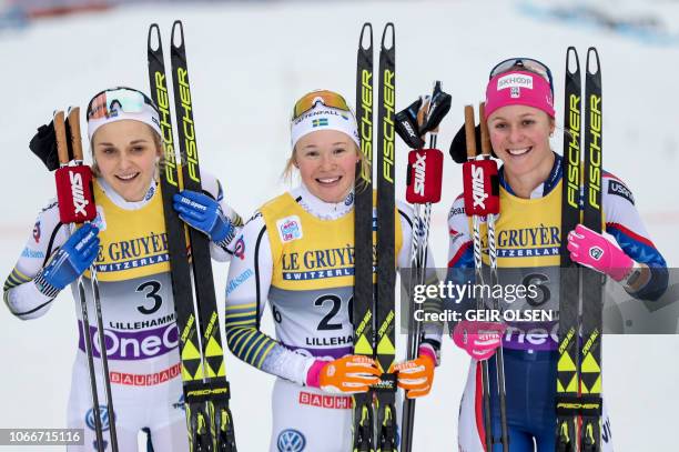 Second placed Stina Nilsson of Sweden, winner Jonna Sundling of Sweden and third placed Sadie Bjornsen of the US pose after the women´s Cross Country...