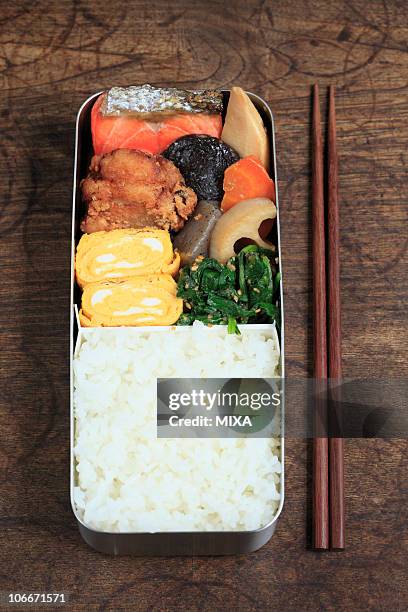 japanese cuisine lunch box - chikuzenni stockfoto's en -beelden