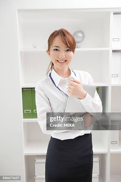 businesswoman holding tablet - skirt stock photos et images de collection