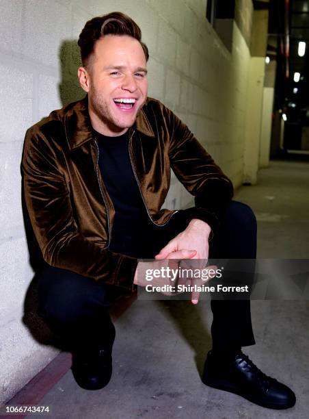 Olly Murs poses backstage after meeting fans and signing copies of his new album 'You Know I Know' at HMV Manchester on November 12, 2018 in...