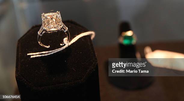 Carat ladies emerald cut diamond engagement ring is displayed with other jewelry at a press preview of an auction of 400 pieces of personal property,...