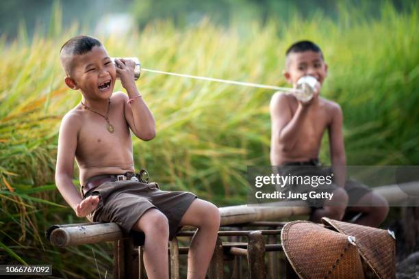 happy asian boy talk with friend - vietnam school stock pictures, royalty-free photos & images