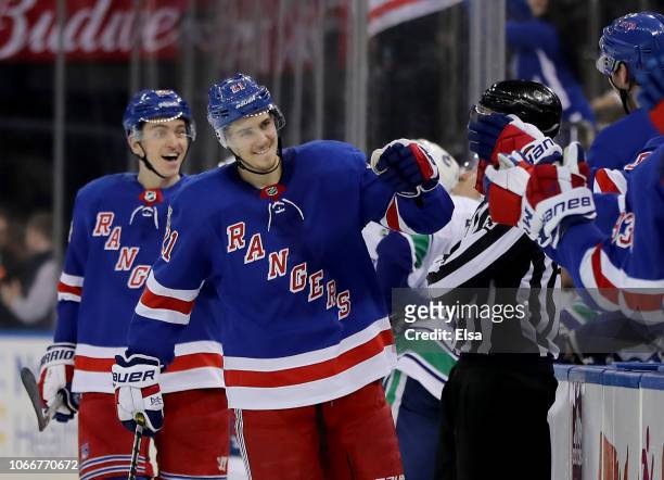 Brett Howden of the New York Rangers celebrates his game winning goal with teammates on the bench in the third period against the Vancouver Canucks...