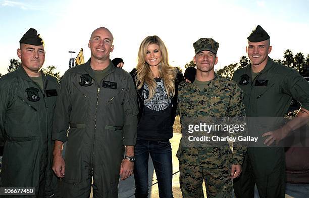 Supermodel and motorcycle enthusiast Marisa Miller interacts with military personel at Marine Corps Base Camp Pendleton on November 9, 2010 in...