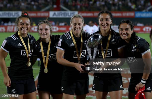 Players of New Zealand Women's Rugby Sevens team celebrate with the trophy after winning the HSBC World Rugby Women's Sevens Series Cup Final match...