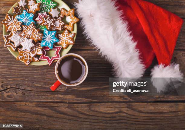 christmas cappuccino and gingerbread cookies on rustic wooden table - christmas breakfast stock pictures, royalty-free photos & images