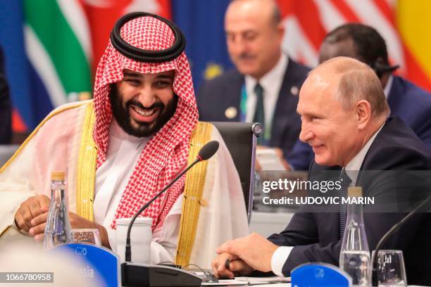 Russia's President Vladimir Putin and Saudi Arabia's Crown Prince Mohammed bin Salman attend the G20 Leaders' Summit in Buenos Aires, on November 30,...