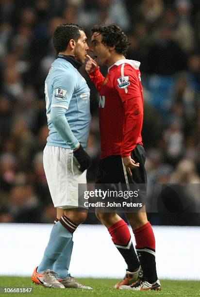 Rafael Da Silva of Manchester United clashes with Carlos Tevez of Manchester City during the Barclays Premier League match between Manchester City...