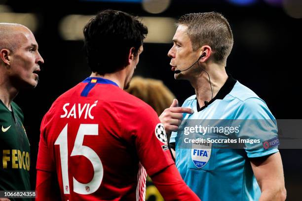 Andrea Raggi of AS Monaco, Savic of Atletico Madrid, Mattias Gestranius referee during the UEFA Champions League match between Atletico Madrid v AS...
