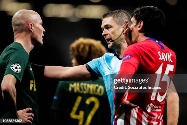Andrea Raggi of AS Monaco, Mattias Gestranius referee, Savic of Atletico Madrid during the UEFA Champions League match between Atletico Madrid v AS...
