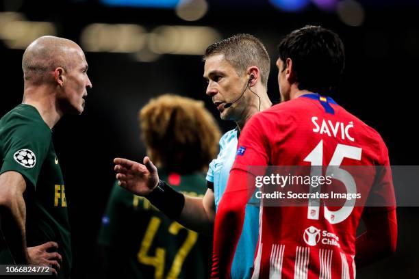Andrea Raggi of AS Monaco, Mattias Gestranius referee, Savic of Atletico Madrid during the UEFA Champions League match between Atletico Madrid v AS...
