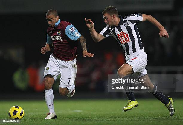 Kieron Dyer of West Ham contests with James Morrison of West Bromwich during the Barclays Premier League match between West Ham United and West...