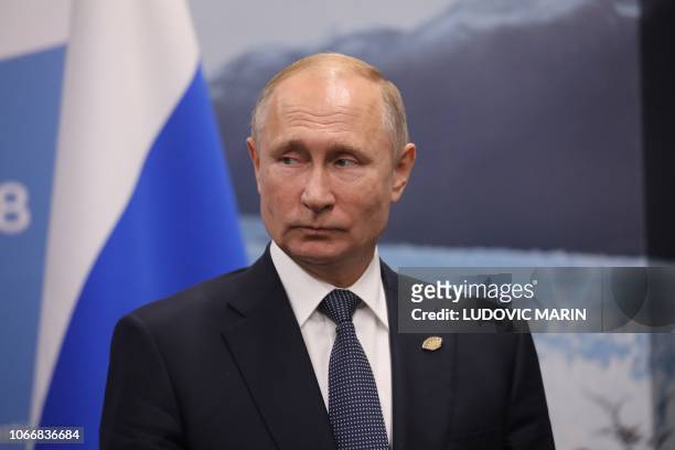 Russia's President Vladimir Putin gestures during a meeting with France's President Emmanuel Macron in the sidelines of the G20 Leaders' Summit in...