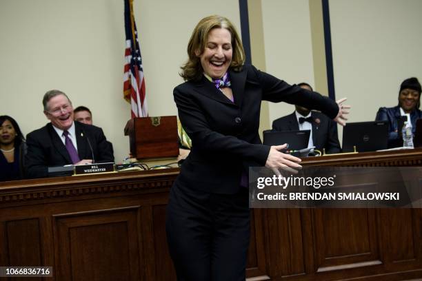 Representative-elect Kim Schrier does the flossing dance before drawing a number during an office lottery for new members of Congress on Capitol Hill...