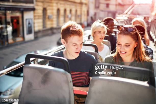 open top bus tour in the city - open top bus stock pictures, royalty-free photos & images