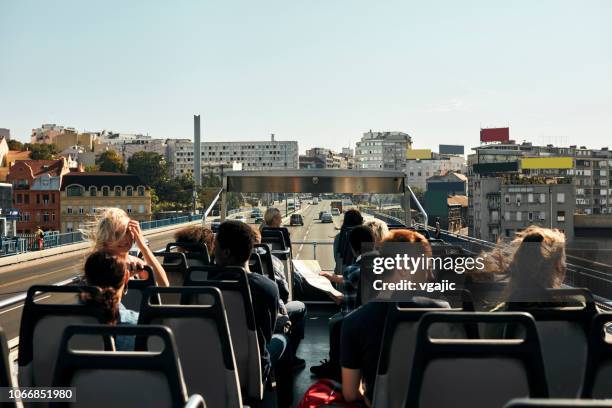 open top bus tour in the city - open top bus stock pictures, royalty-free photos & images