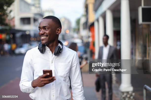 portrait of a young man at the bus stop. - no ordinary love stockfoto's en -beelden