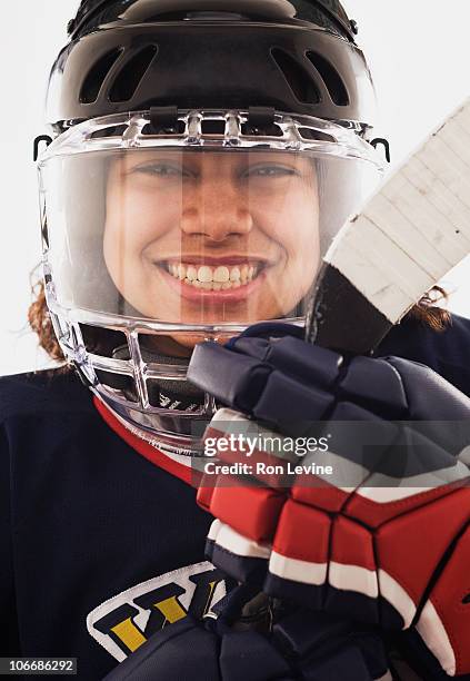 teen girl wearing hockey gear, portrait - girls ice hockey stock pictures, royalty-free photos & images