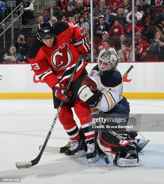 Jhonas Enroth of the Buffalo Sabres makes the kick save against David Clarkson of the New Jersey Devils at the Prudential Center on November 10, 2010...