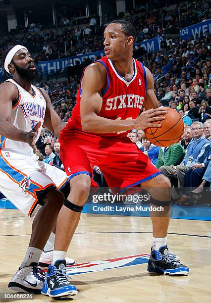 Evan Turner of the Philadelphia 76ers looks to pass against James Harden of the Oklahoma City Thunder on November 10, 2010 at the Ford Center in...