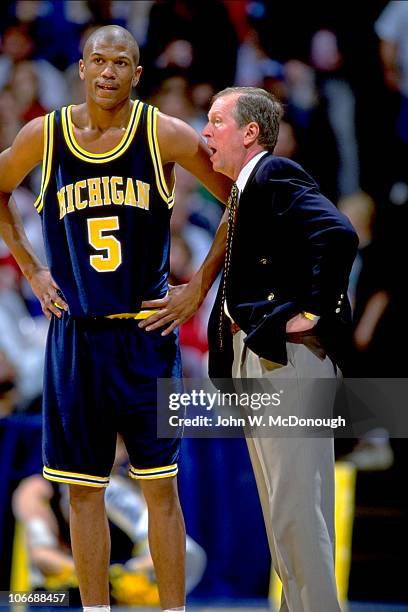 Playoffs: Michigan coach Steve Fisher on sidelines with Jalen Rose during game vs Oklahoma State. Lexington, KY 3/27/1992 CREDIT: John W. McDonough