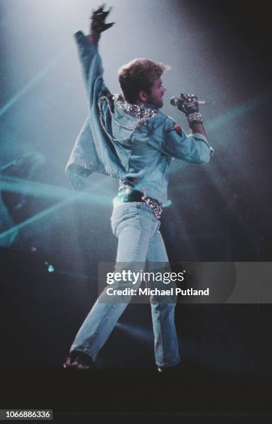 English singer and songwriter George Michael performing on stage during the Japanese/Australasian leg of his Faith World Tour, February-March 1988.