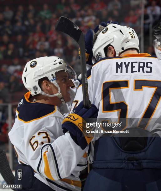 Tyler Ennis of the Buffalo Sabres scores at 8:54 of the third period and celebrates with Tyler Myers in their game against the New Jersey Devils at...