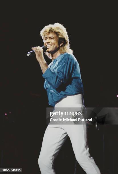 English singer and musician George Michael of Wham! performs live on stage during the Japanese leg of the pop duo's 1985 world tour in January 1985....