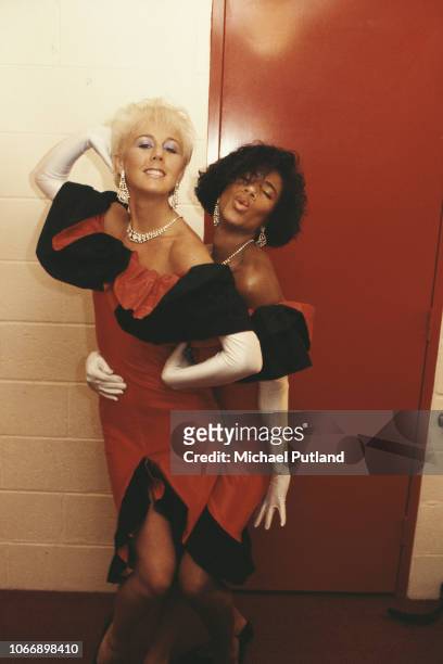 British pop duo Pepsi & Shirlie, backing singers for Wham!, pictured backstage together during the Japanese leg of the group's 'The Big Tour' in...