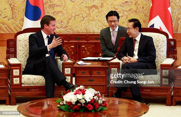 British Prime Minister David Cameron talks with South Korean President Lee Myung-Bak during their meeting during day one of the 2010 G20 Summit on...