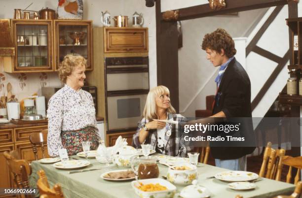 Actors Jean Boht, Rita Tushingham and Jonathan Morris in a kitchen scene from the BBC television sitcom 'Bread', August 21st 1988.