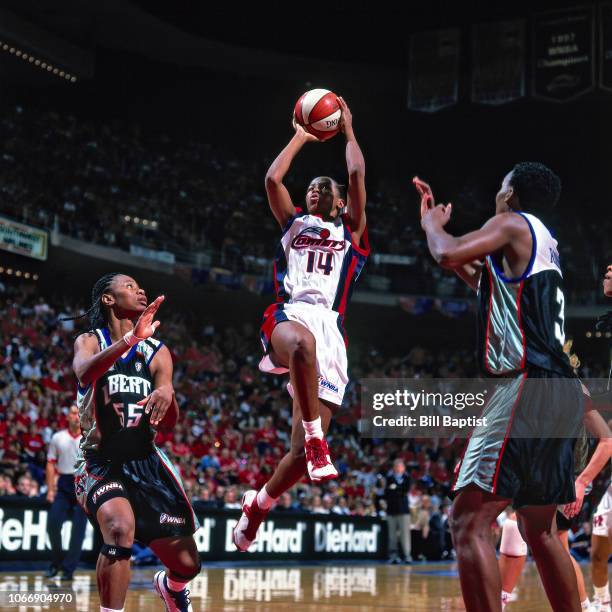 Cynthia Cooper of the Houston Comets shoots during Game Three of the 1999 WNBA Finals on September 5, 1999 at the Compaq Center in Houston, Texas....