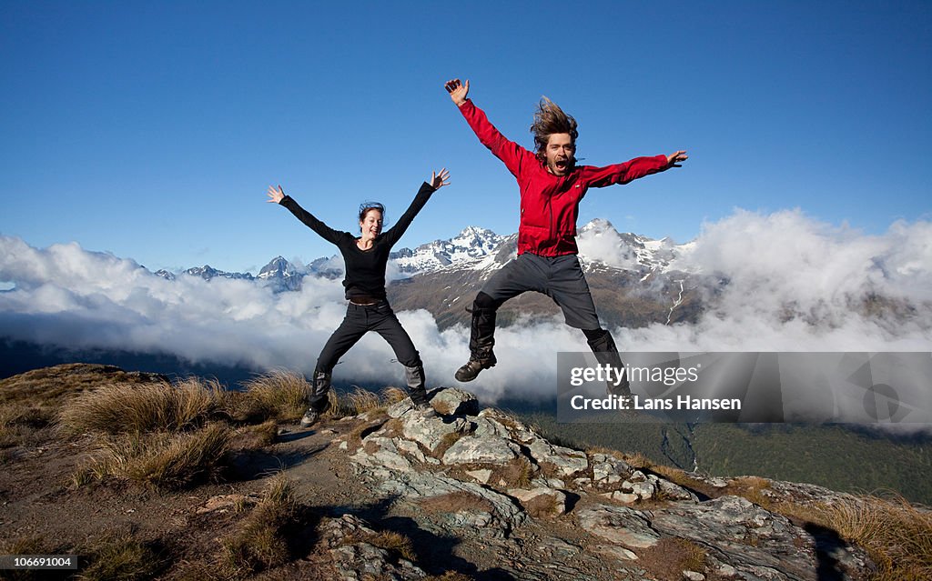 Jumping man and woman