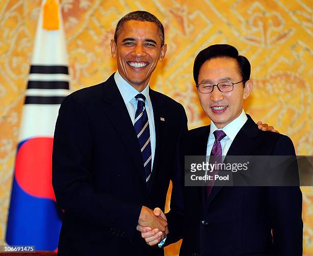 President Barack Obama shakes hands with South Korean President Lee Myung-bak during their bilateral meeting at the Presidential Blue House on...