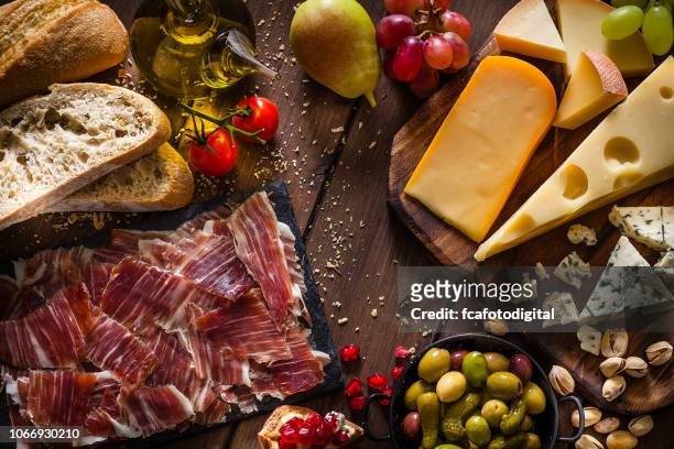 delicious mediterranean appetizer shot from above - cheese plate stock pictures, royalty-free photos & images