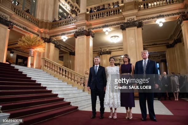 President Donald Trump and her wife US First Lady Melania Trump pose with Argentina's President Mauricio Macri and his wife Argentina's First Lady...
